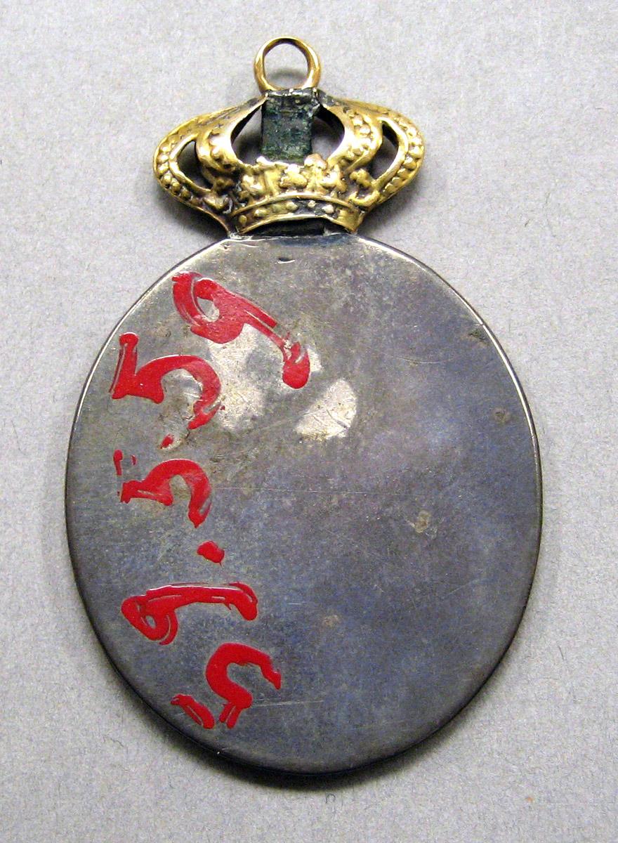 1959.0559 Medal underside