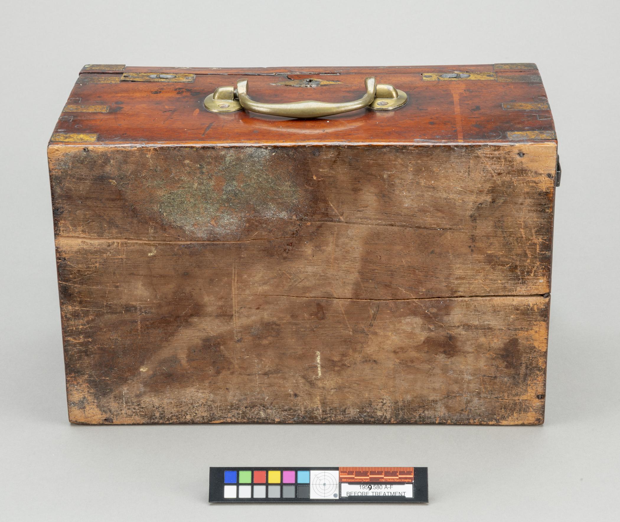 1959.0580 A Box, view 5, before conservation treatment