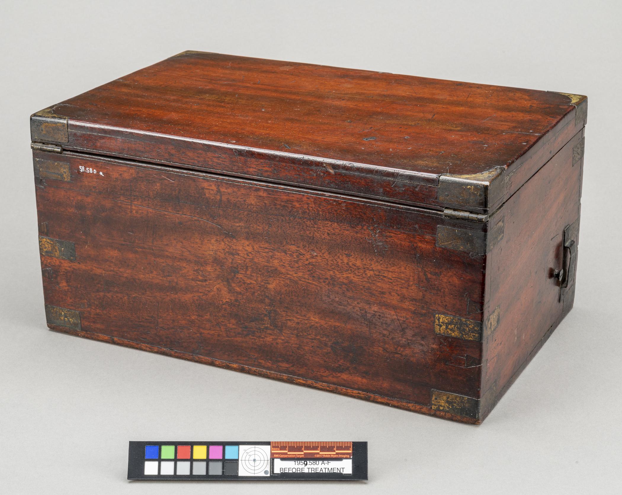 1959.0580 A Box, view 3, before conservation treatment