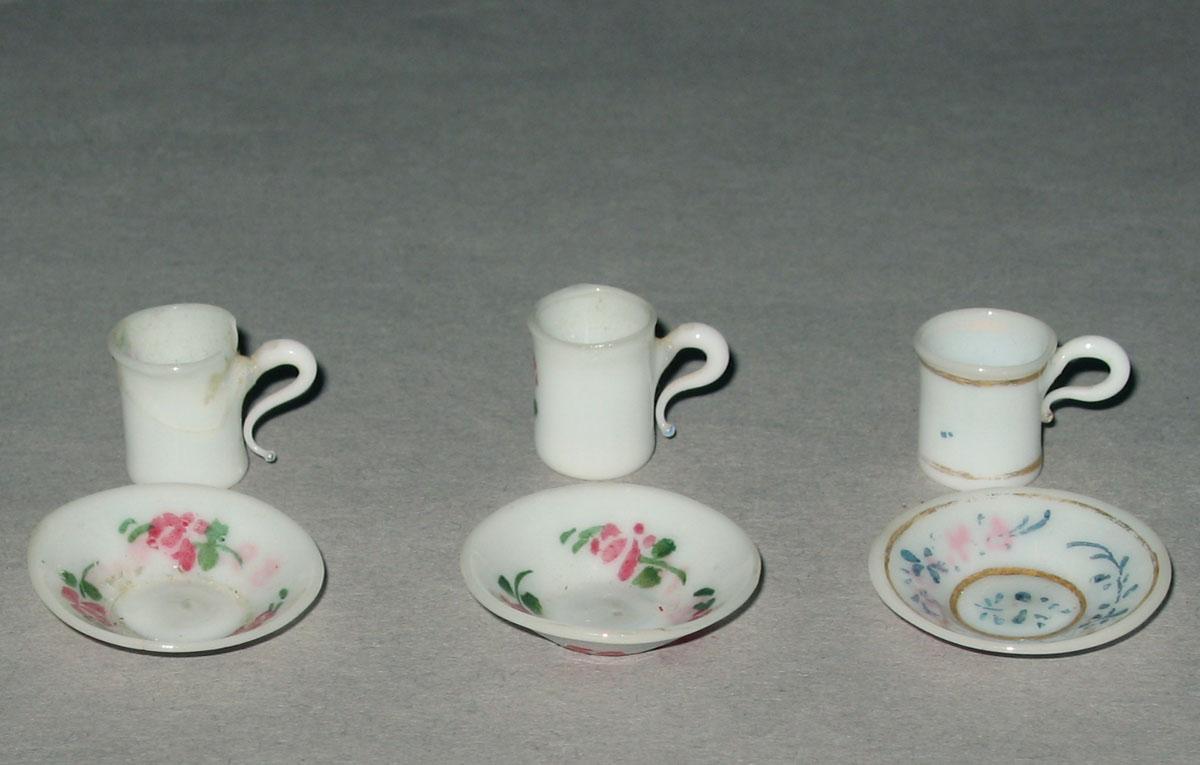 1959.0998.016, .019, .012, .011, 1964.1396.003, 1964.1397.005 Miniature glass teacups and saucers