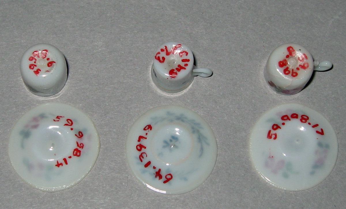 1959.0998.006, .008, .014, .017, 1964.1397.003, .009 Miniature teacups and saucers (undersides)