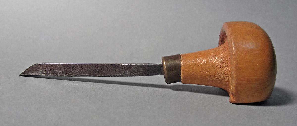 1986.0050.149, Graver, side 1