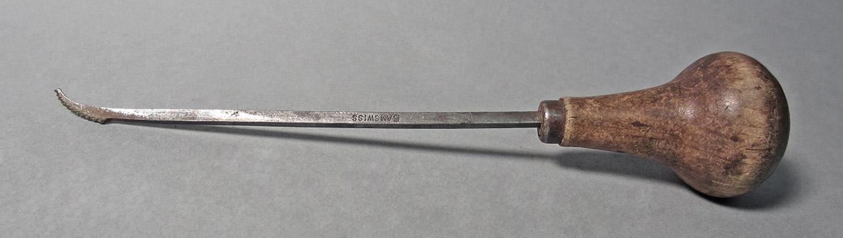 1986.0050.156, Graver, side 1