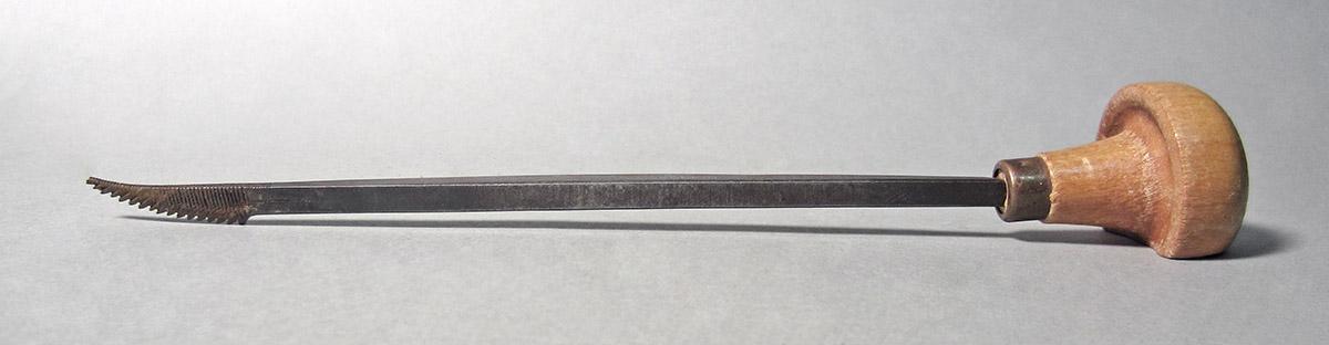 1986.0050.157, Graver, side 1