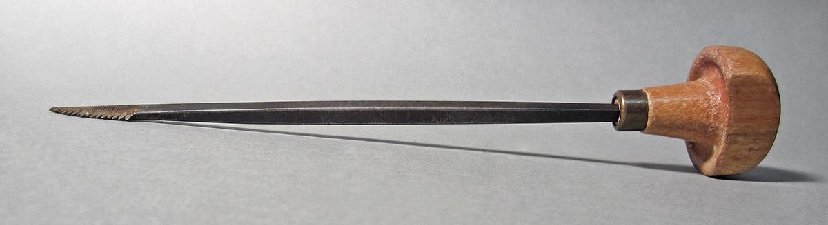 1986.0050.157, Graver, side 2