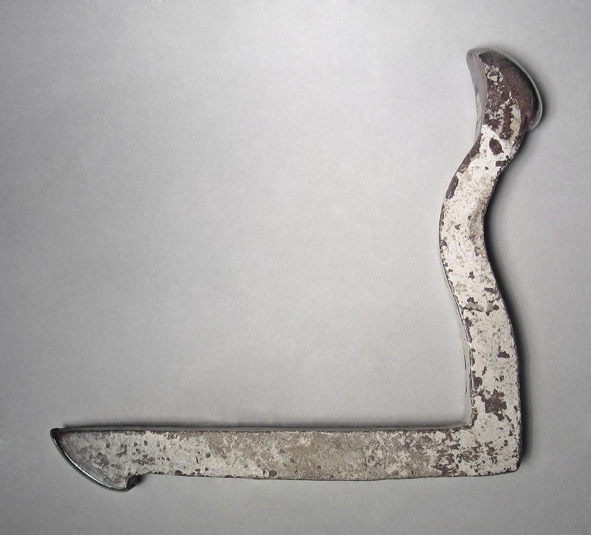1986.0050.238, Snarling iron, side 1