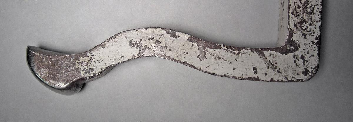 1986.0050.238, Snarling iron, end 1