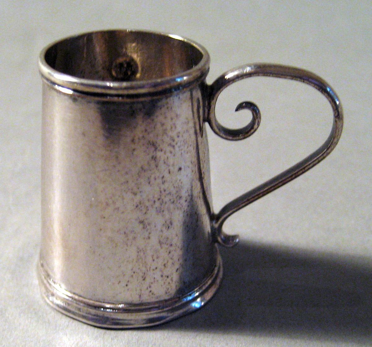 1959.1034 Silver Mug side 1