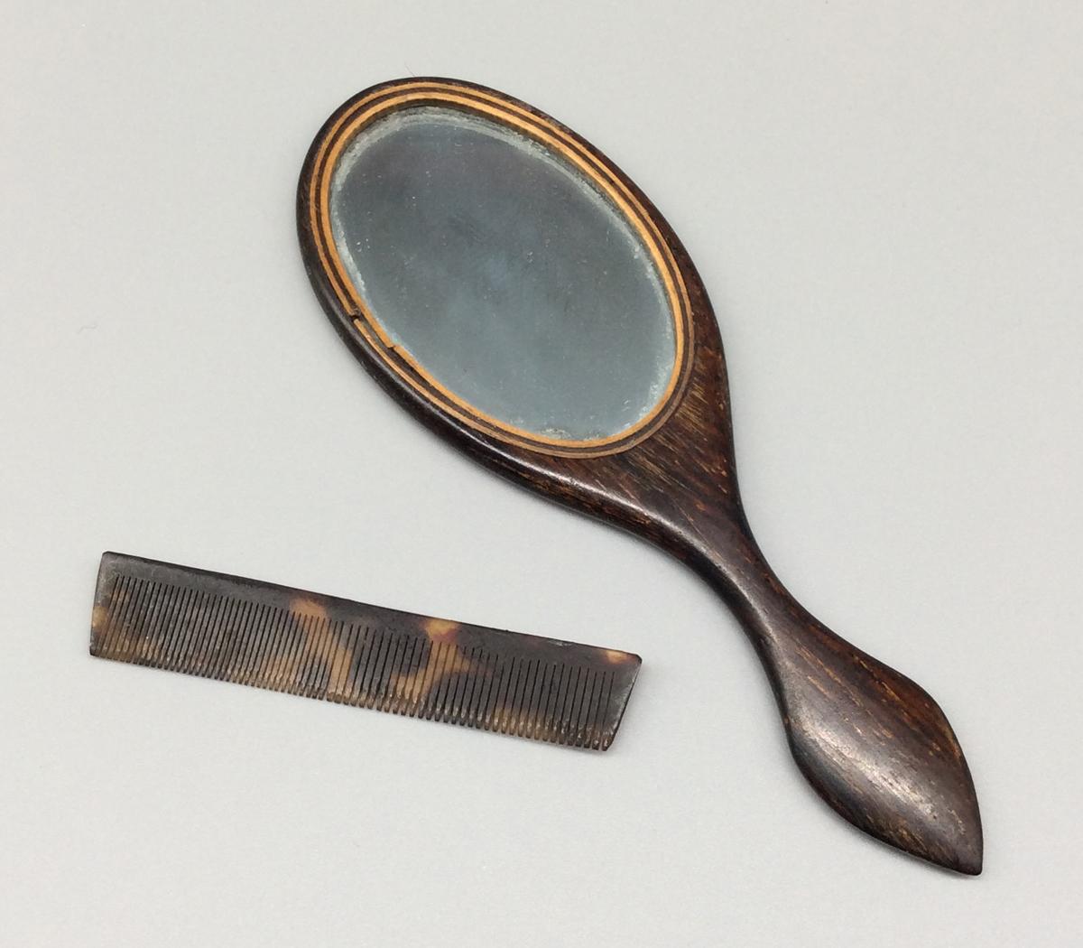 1959.1050.001-.002 Looking glass or mirror and Comb, view 1