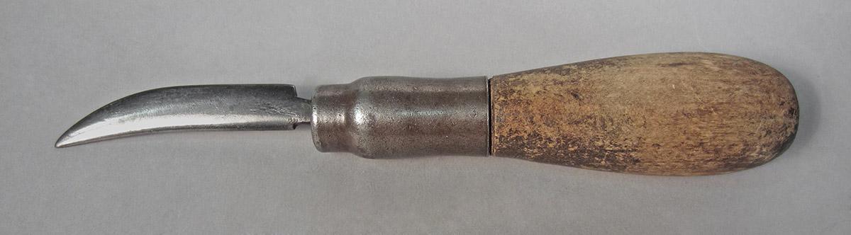 1986.0050.457, Burnisher, side 1