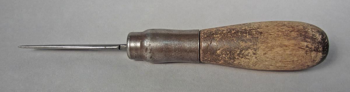 1986.0050.457, Burnisher, side 2