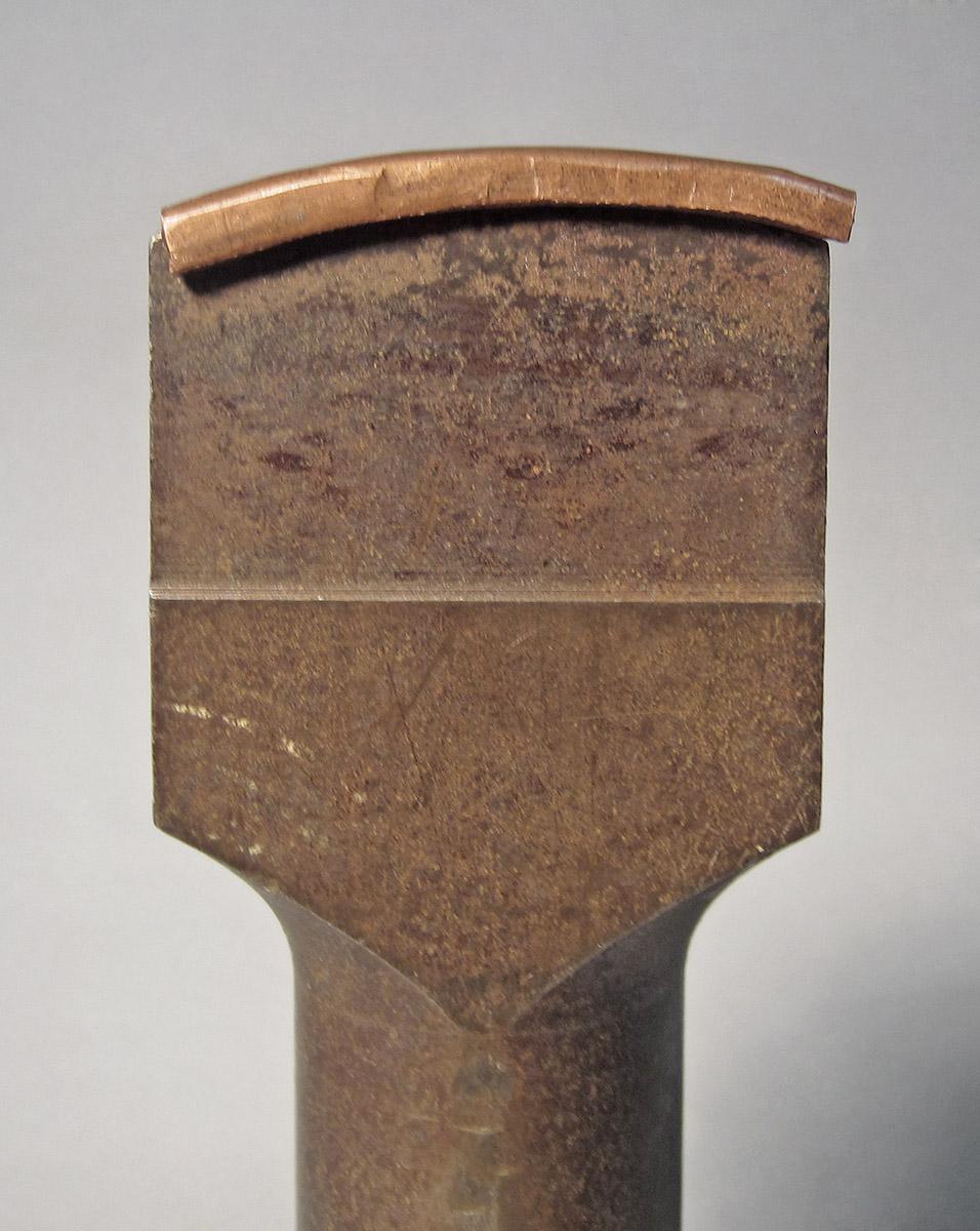 1986.0050.666 A, B, Stake, head with cap side 2