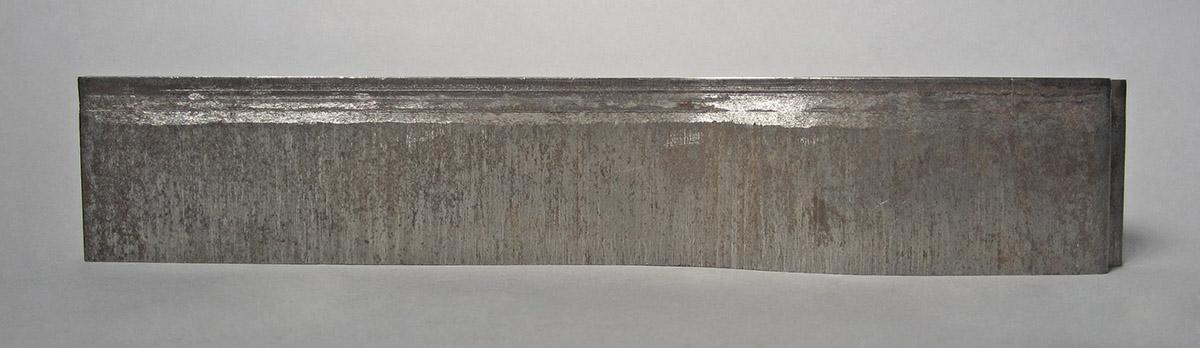 1986.0050.696, Tool, side 1