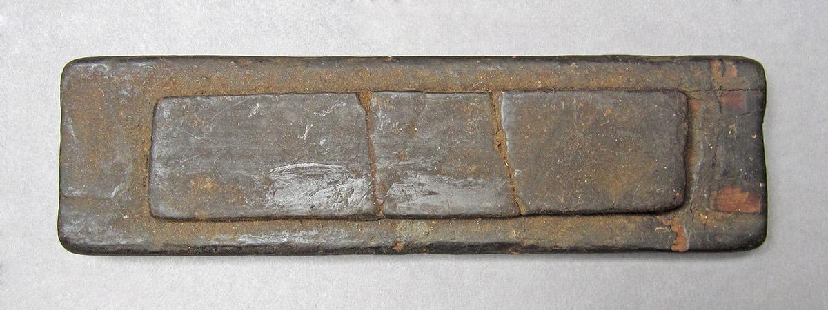 1969.9095, Oil stone, side 1