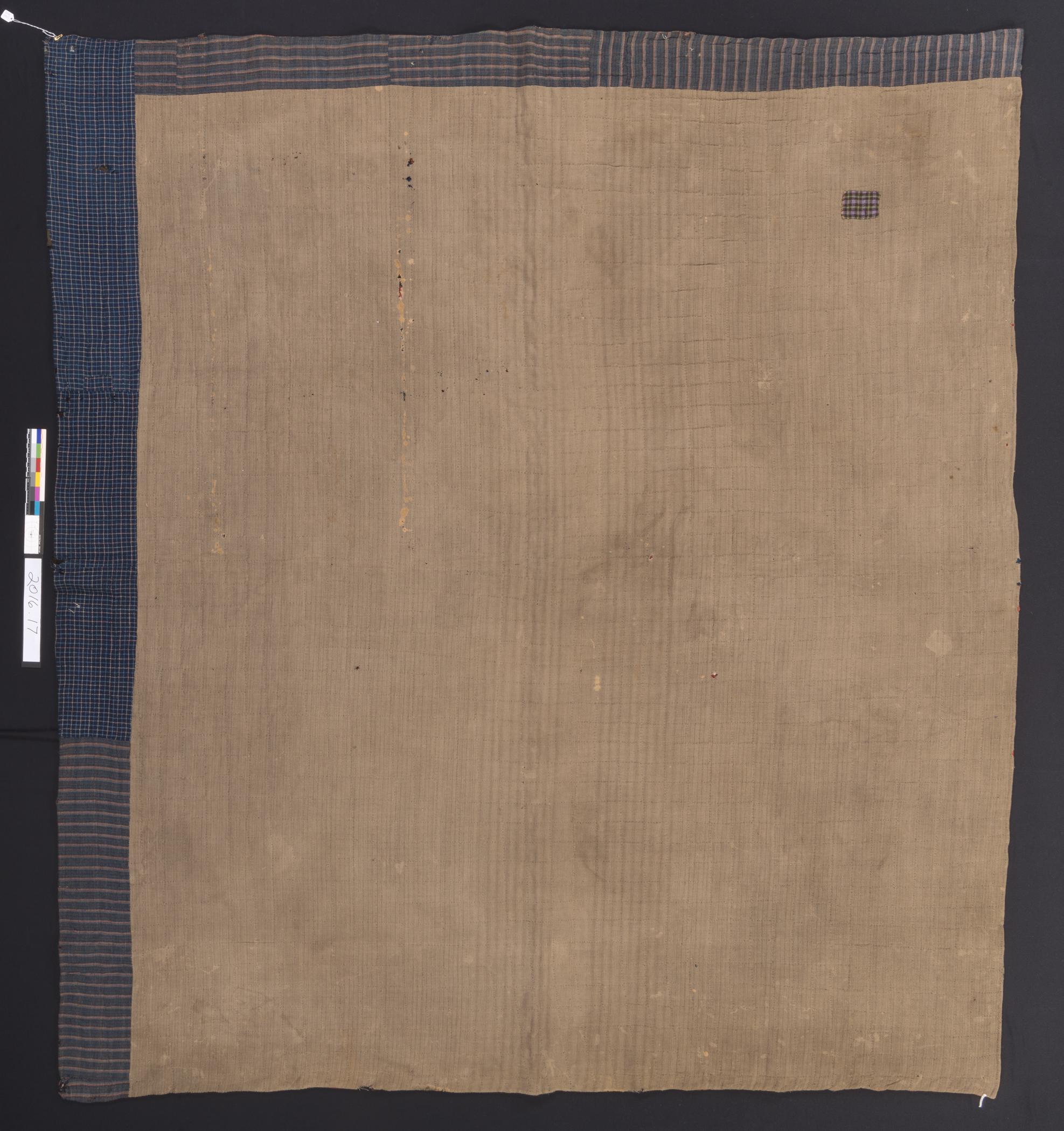 2016.0017 Quilt, view 2, reverse, before conservation treatment