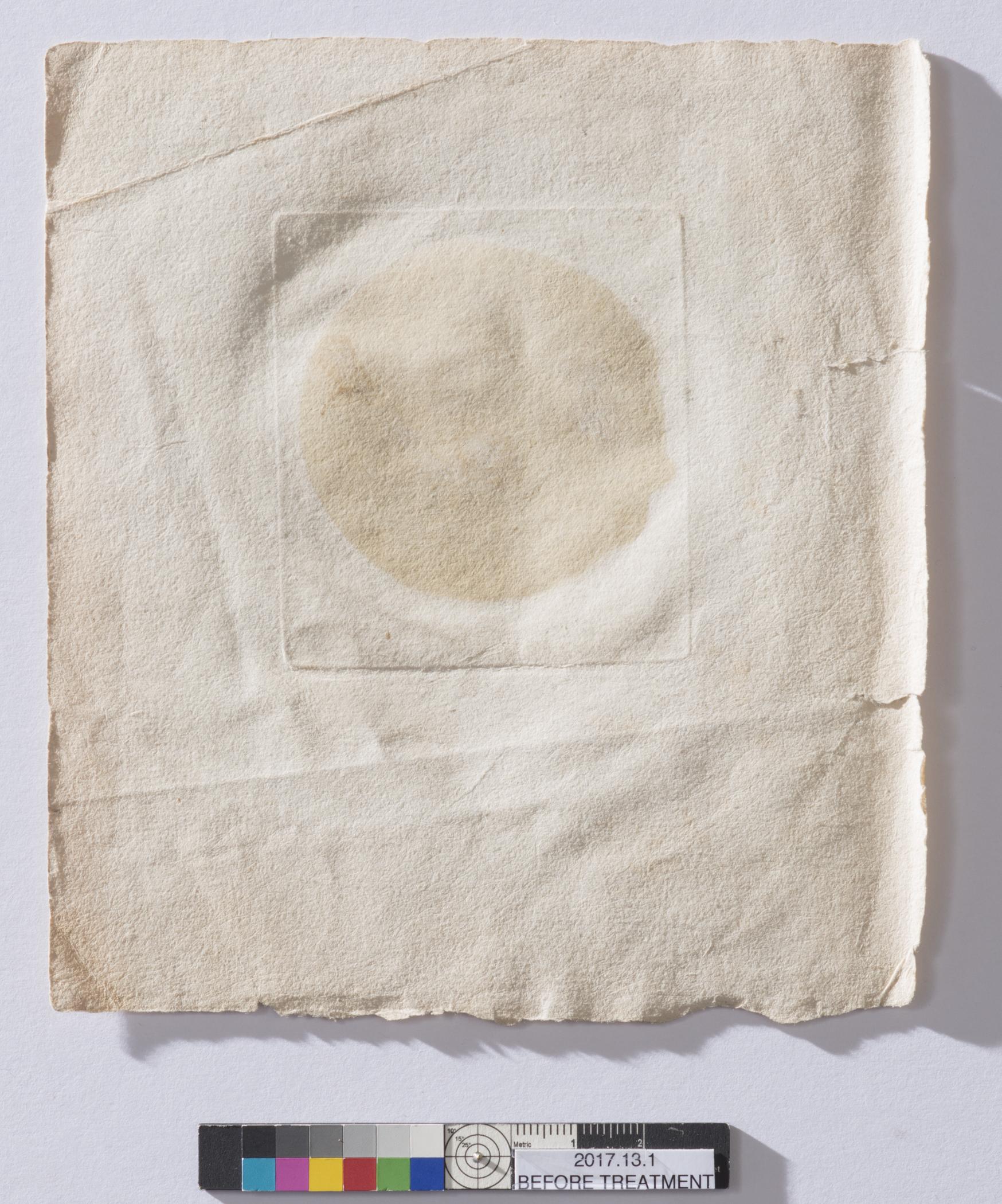 2017.0013.001 Print, view 2, reverse, before conservation treatment, raking light
