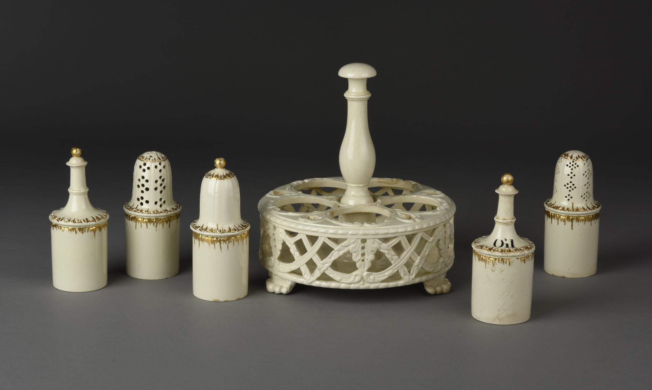 2019.0009 A Cruet frame, B, C, D, E, I, J Bottle and lid, F, G, H Caster, view 2