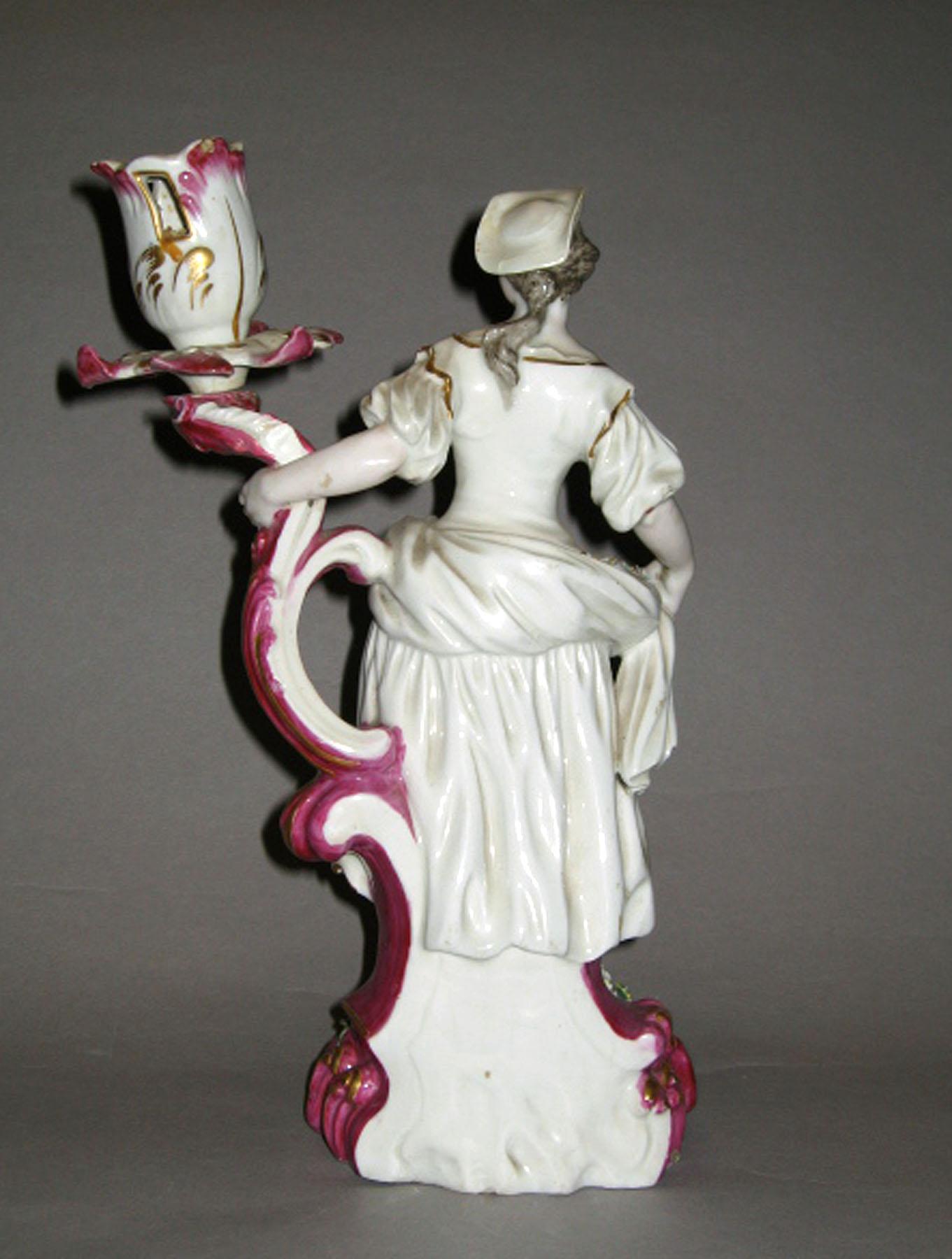 1959.1885.002 Porcelain candlestick figure (reverse)