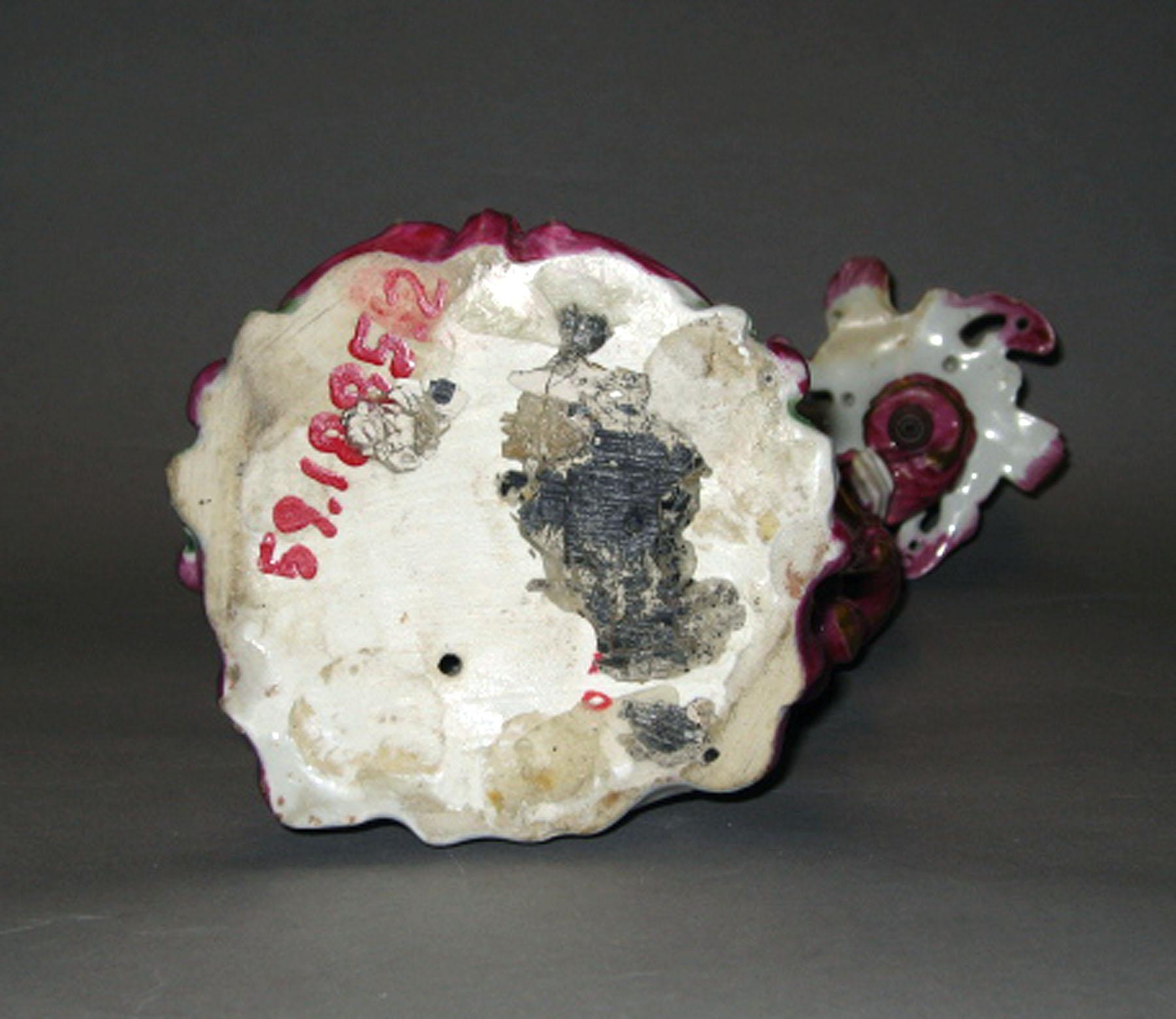 1959.1885.002 Porcelain candlestick figure (underside)