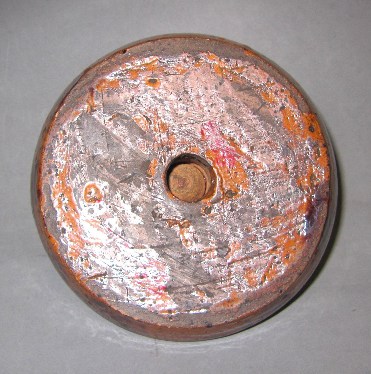 1959.2168 Redware candlestick underside