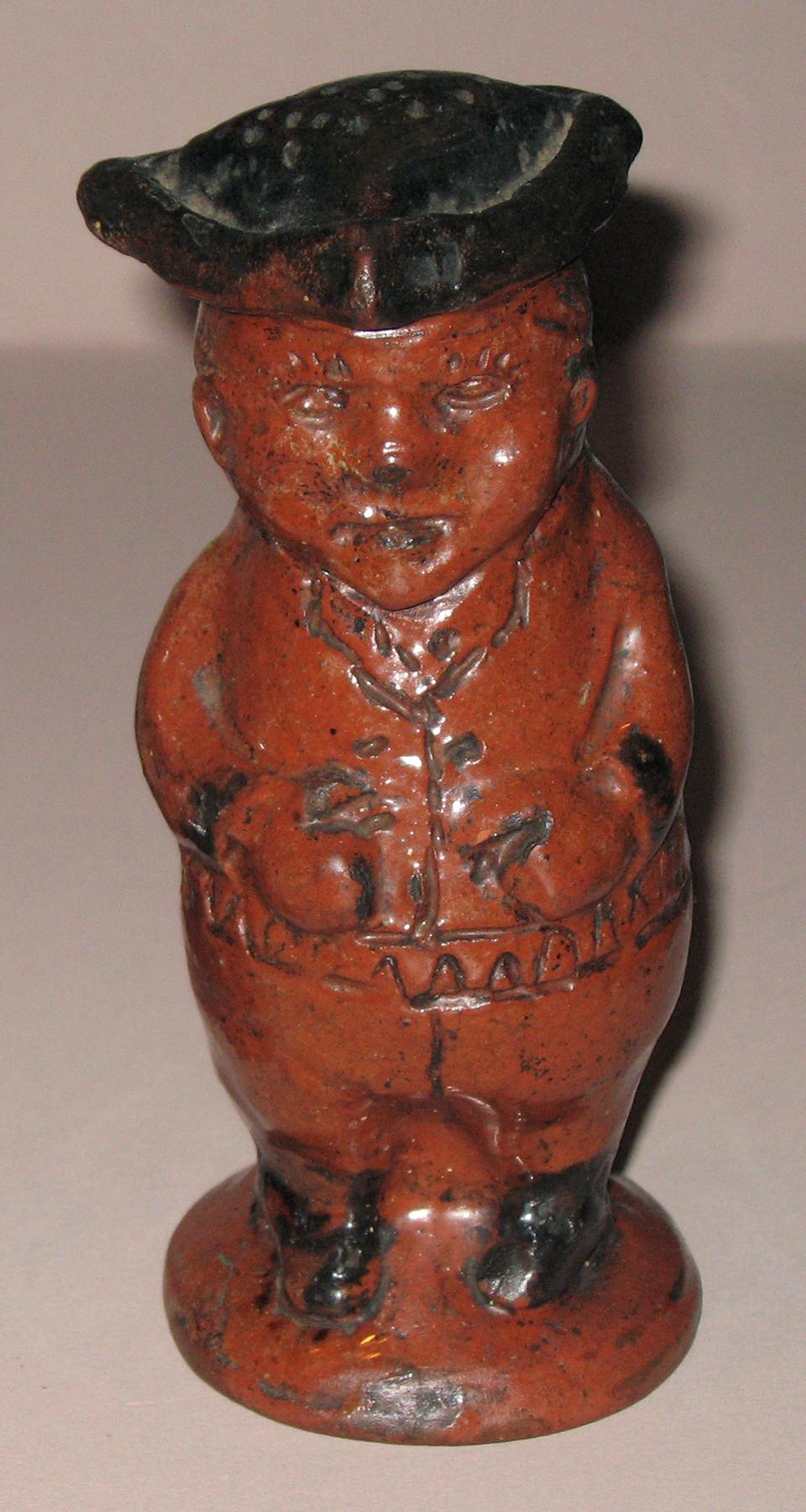 1959.2208 Redware man-shaped caster