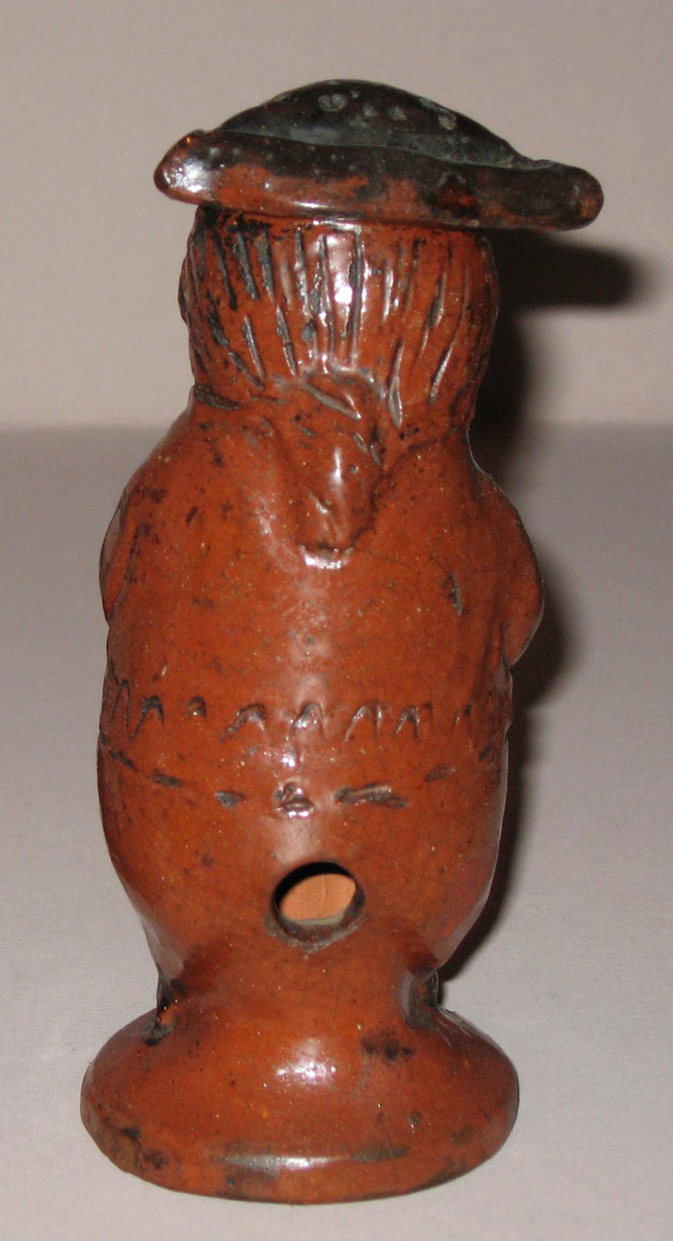 1959.2208 Redware man-shaped caster (back)