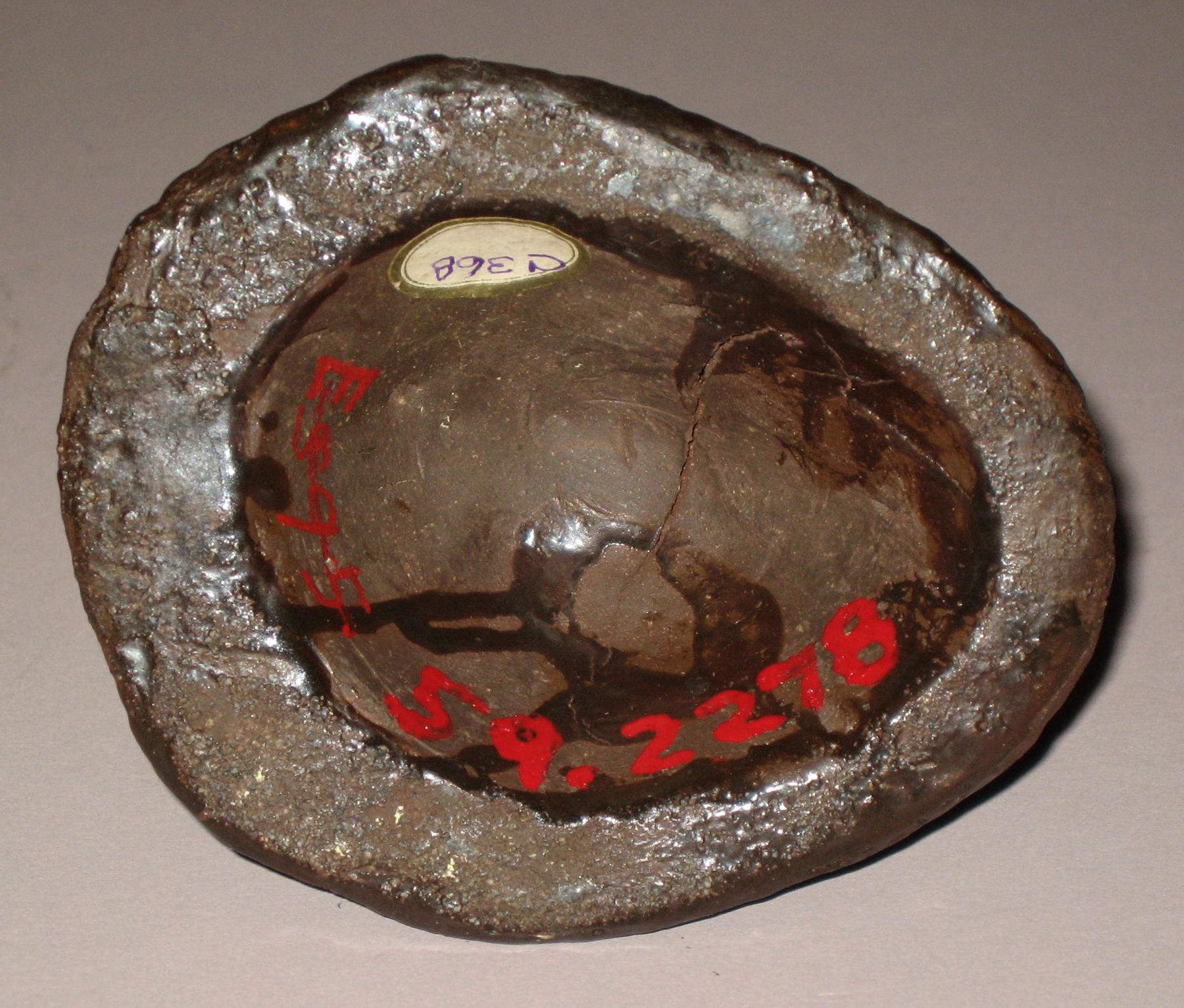 1959.2278 Earthenware lion head (bottom)