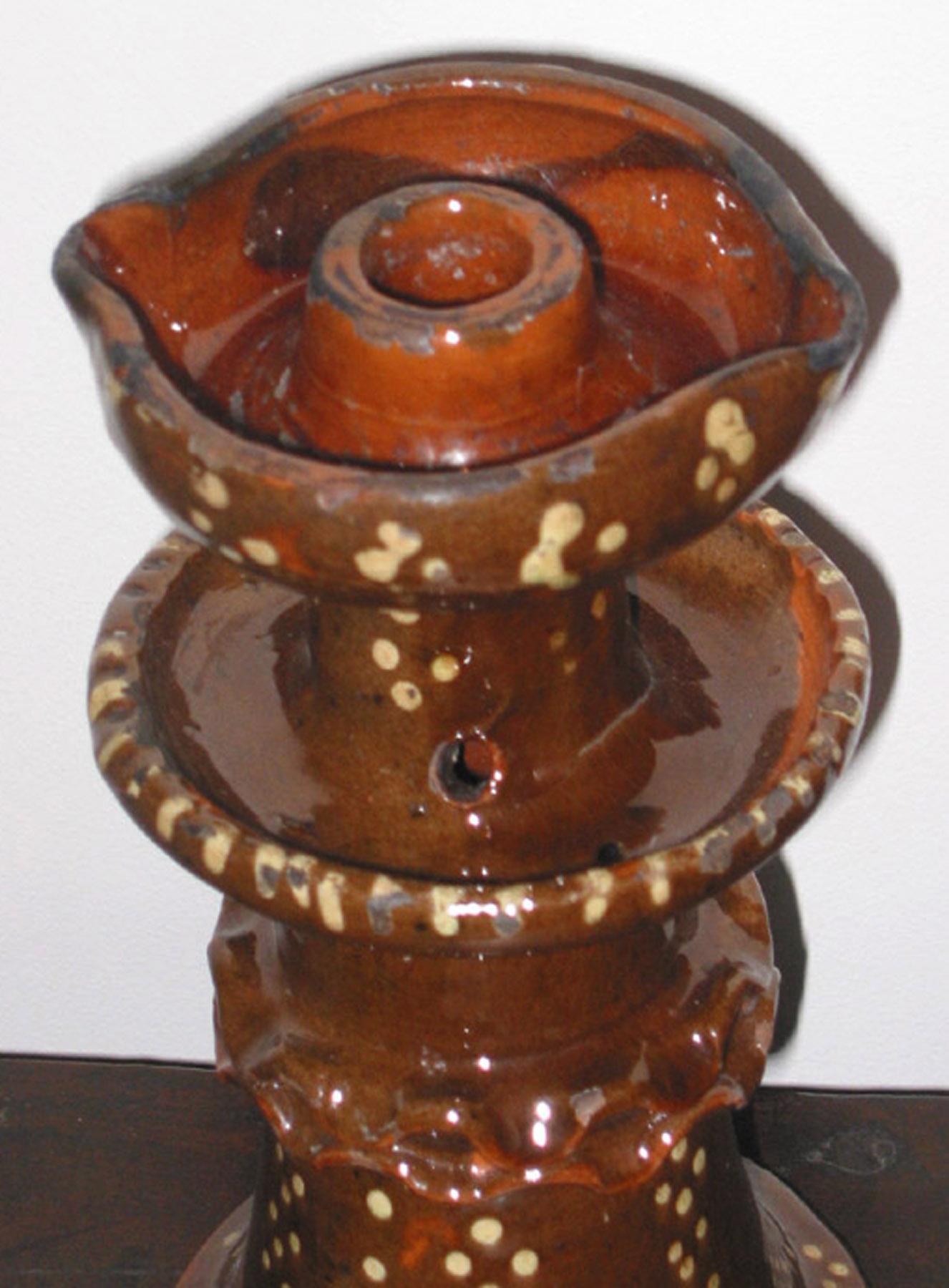 1959.2290 Redware candlestick and oil lamp (detail)