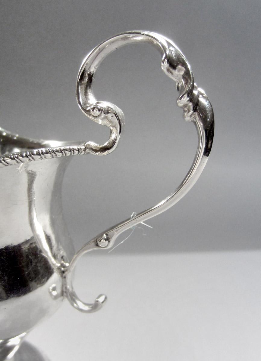1959.2304 Cream pot, handle