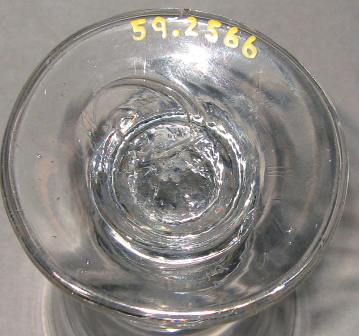 1959.2566 Colorless glass wineglass (underside)
