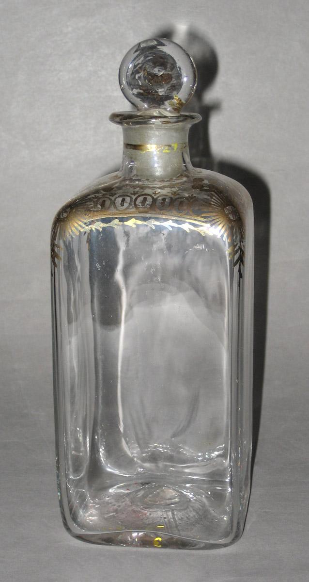1959.2778 E Glass case bottle