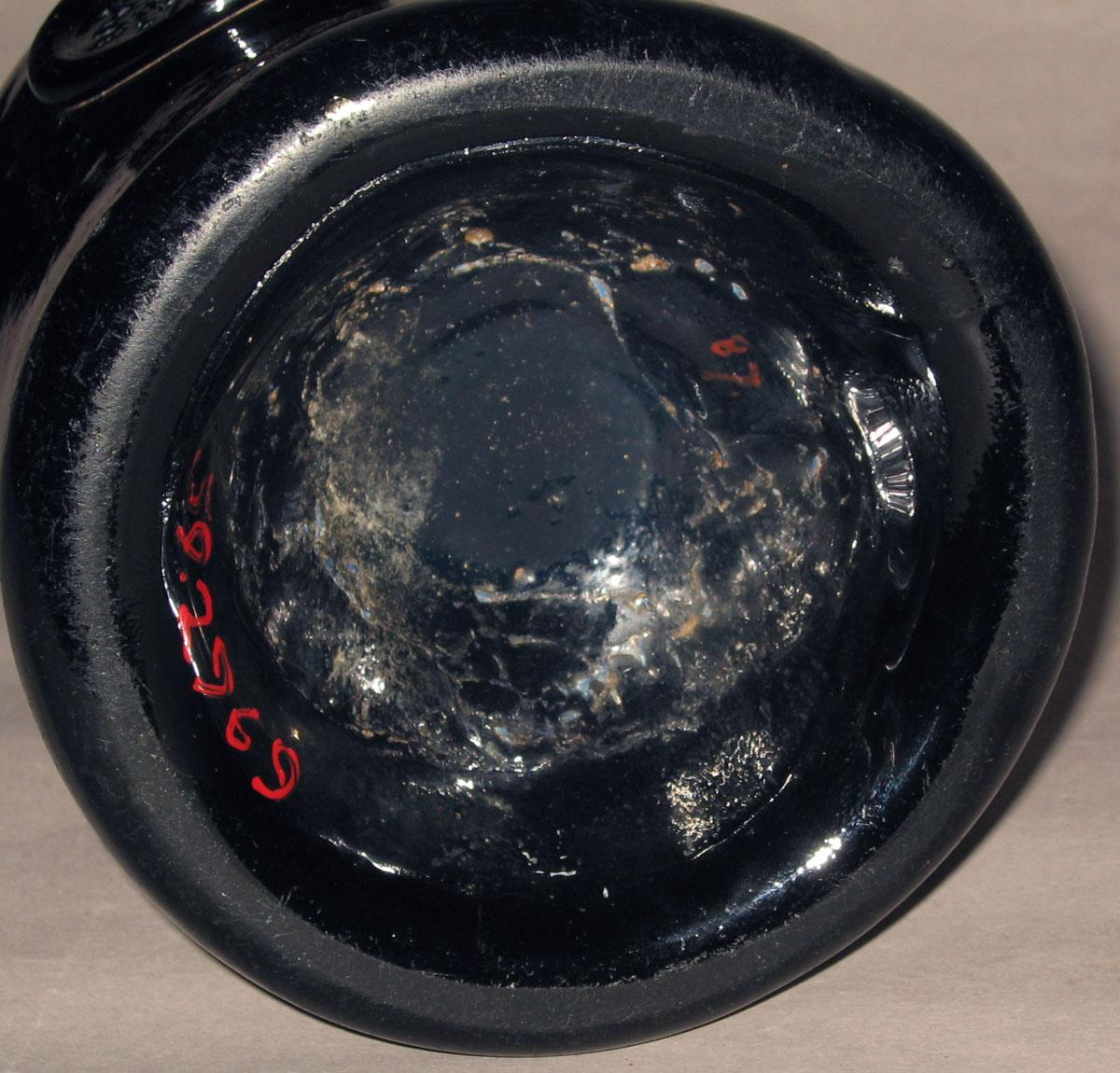1959.2969 Glass wine bottle (underside)