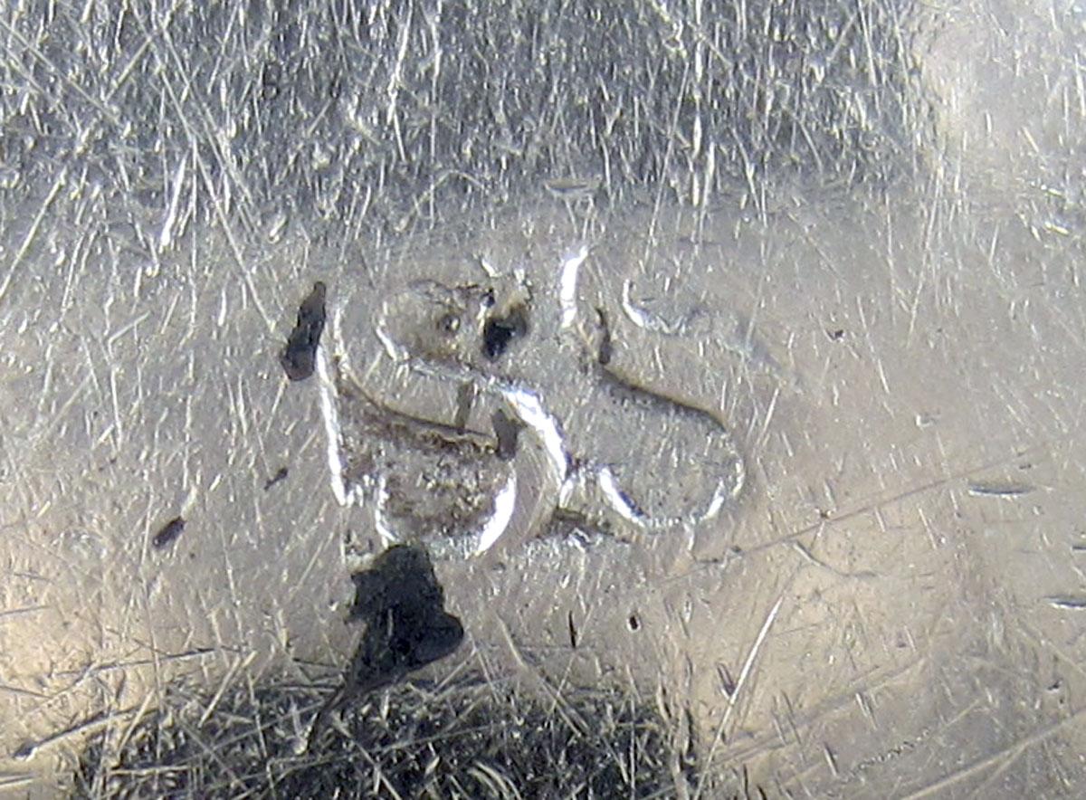 1954.0038 Silver and wood ladle mark