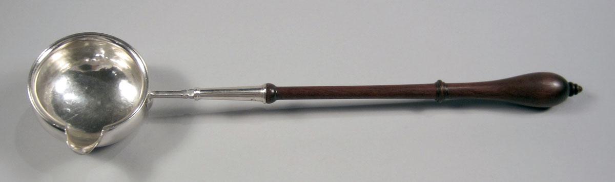 1954.0038 Silver and wood ladle upper surface