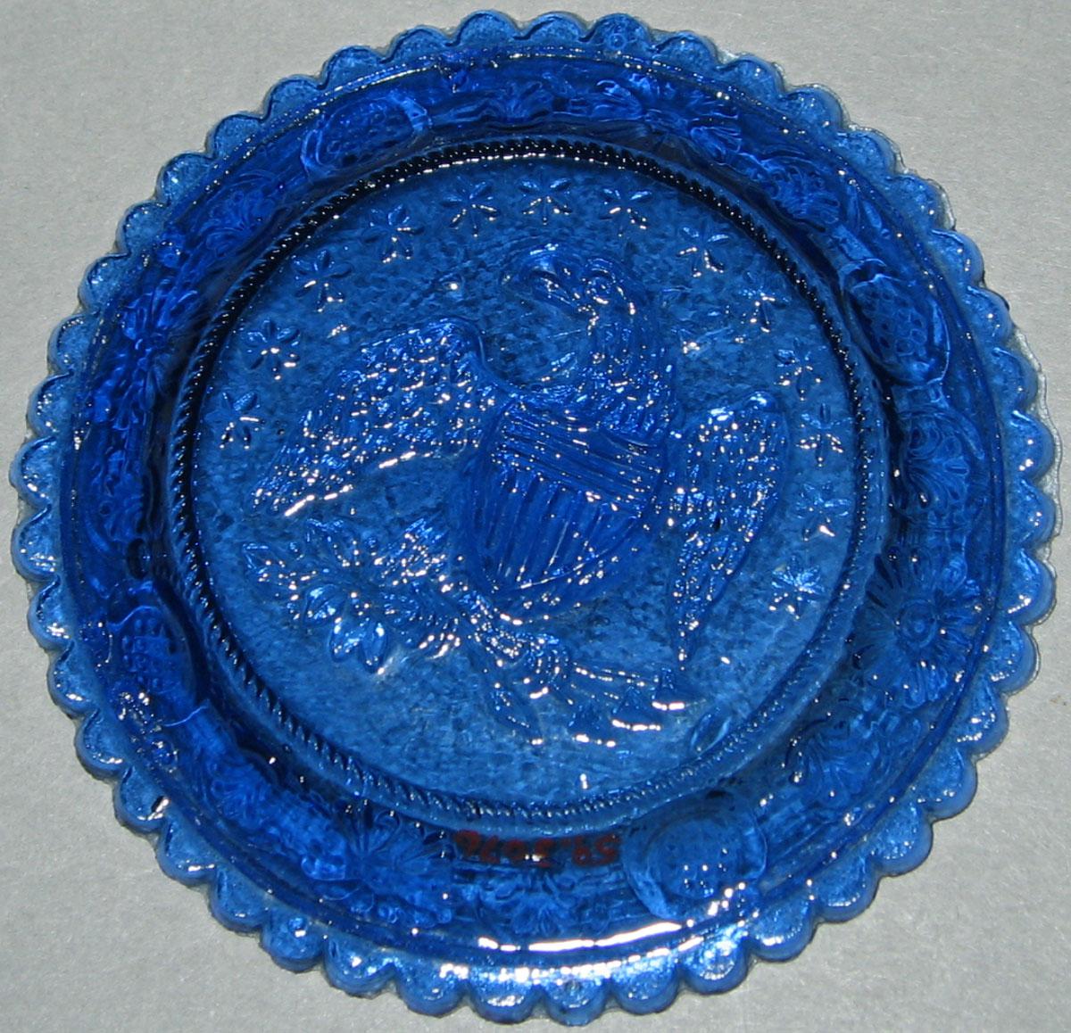 1959.3076 Blue glass cup plate (underside)