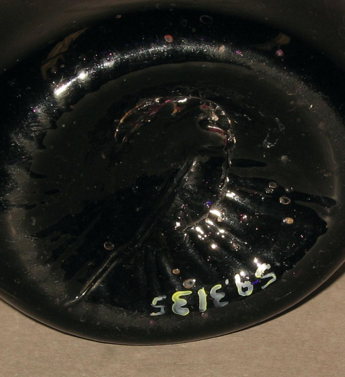 1959.3135 Amethyst glass flask (underside)