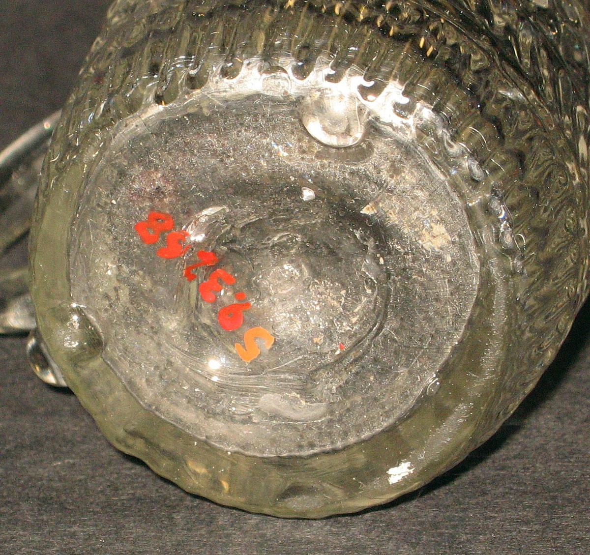 1959.3268 Glass jug (underside)