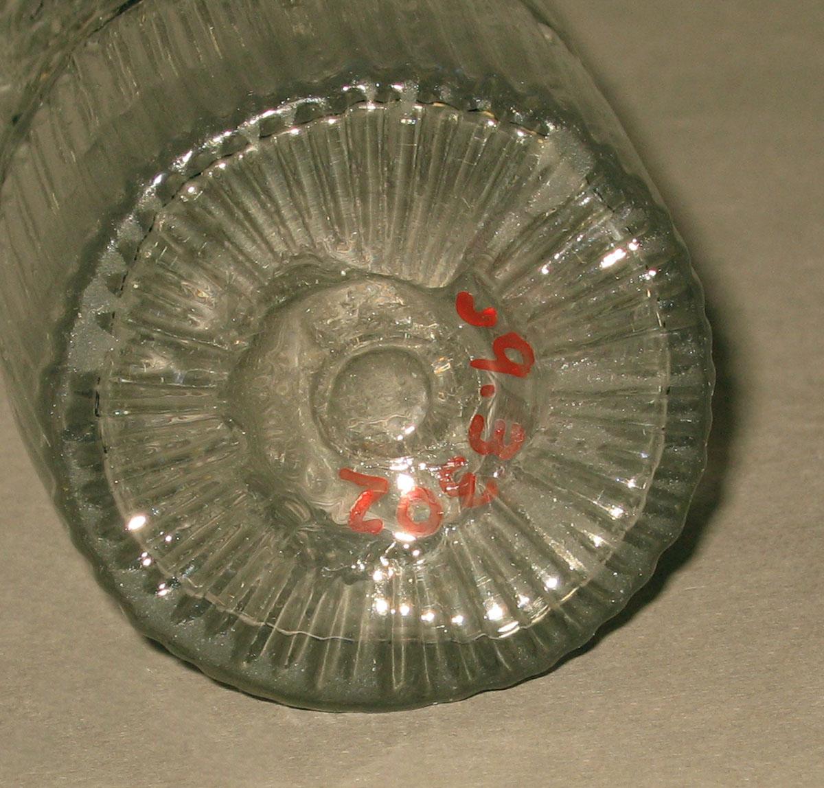 1959.3302 Glass castor (underside)