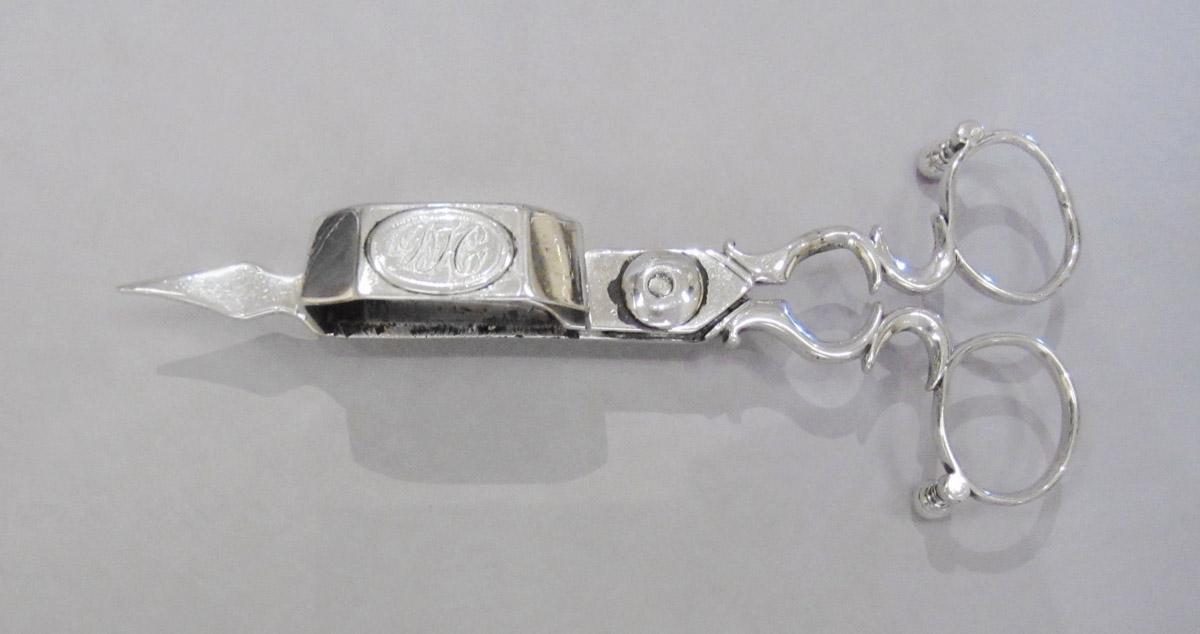 1959.3360 A Snuffer, upper surface