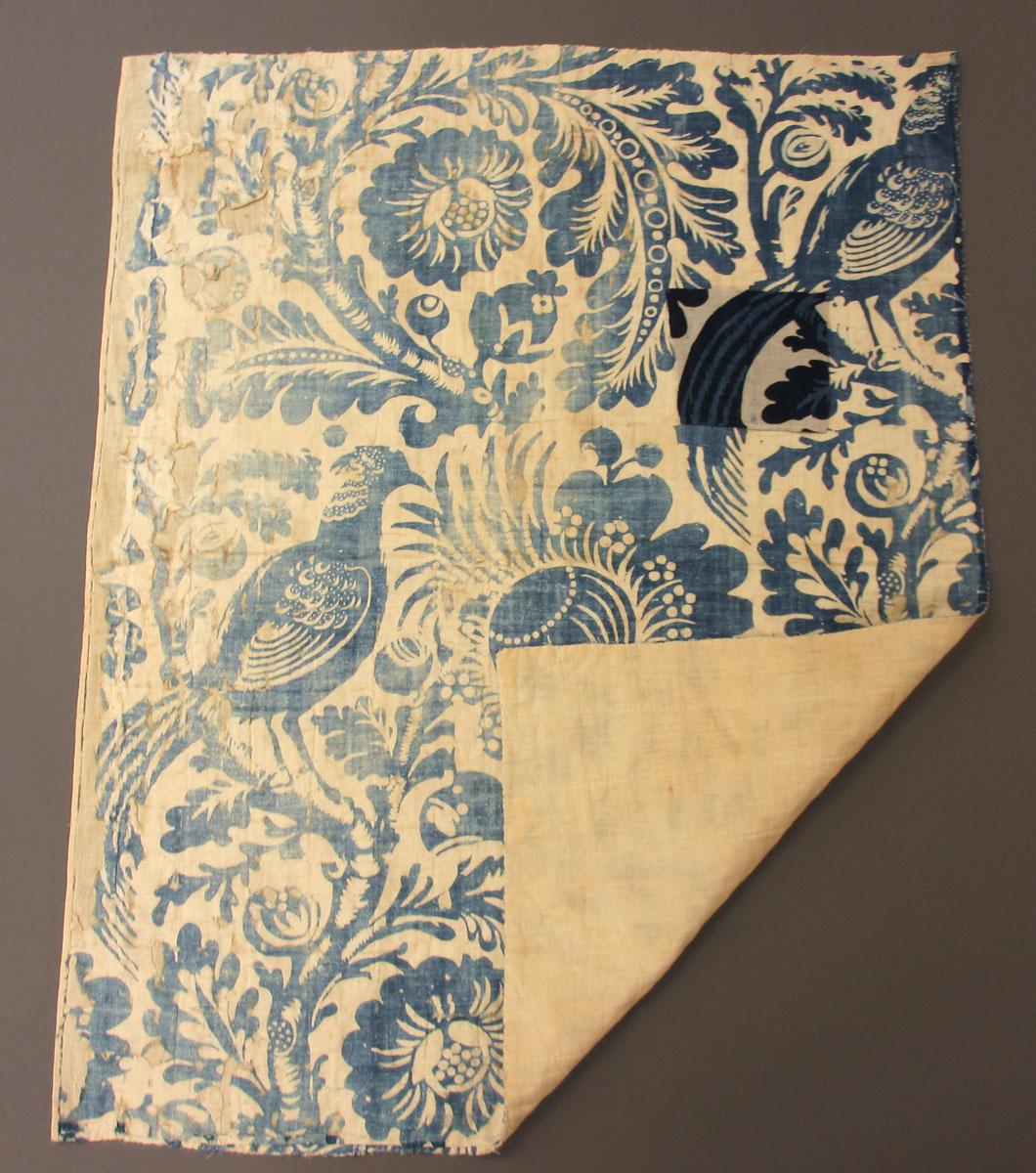 1960.0042.002 Textile, printed partial folded corner