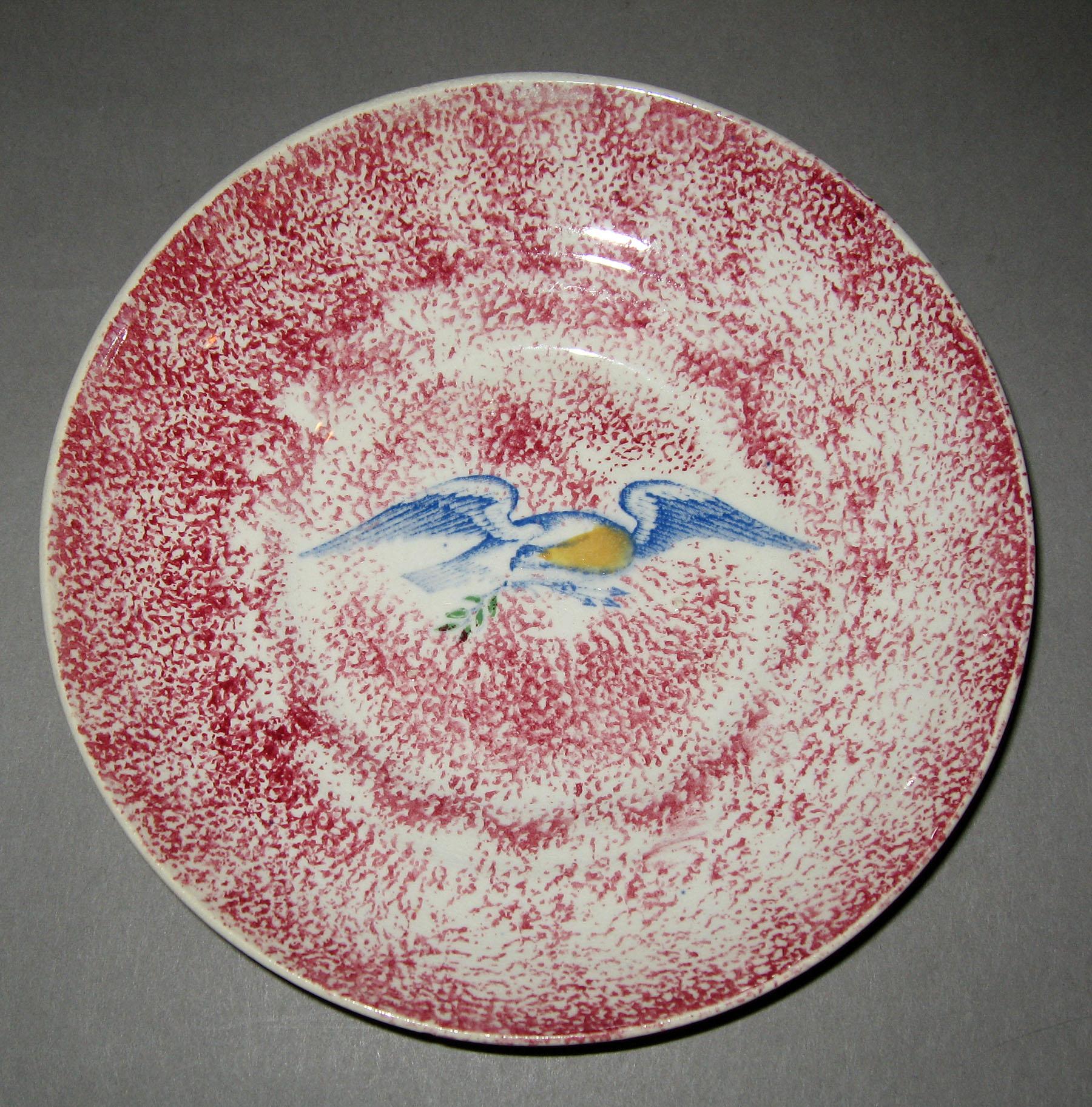 1960.0081 Pink spatterware printed eagle saucer