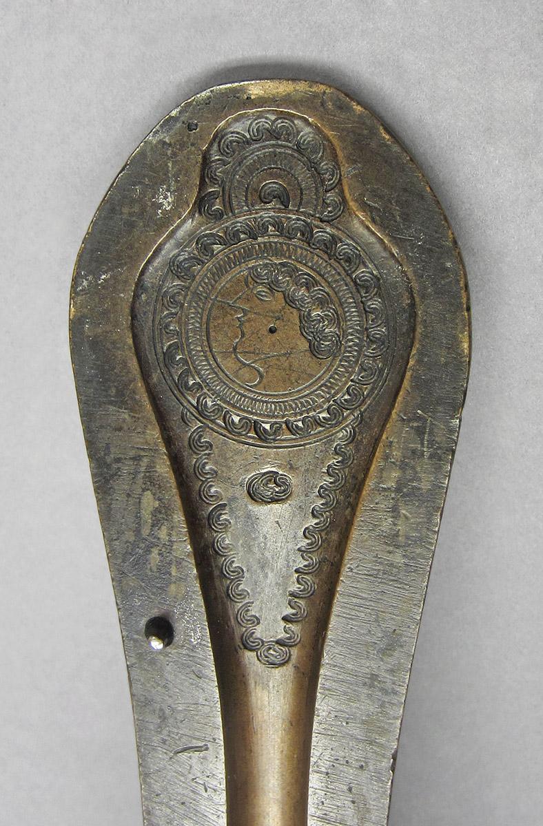 1960.0210, Spoon mold, handle decoration detail