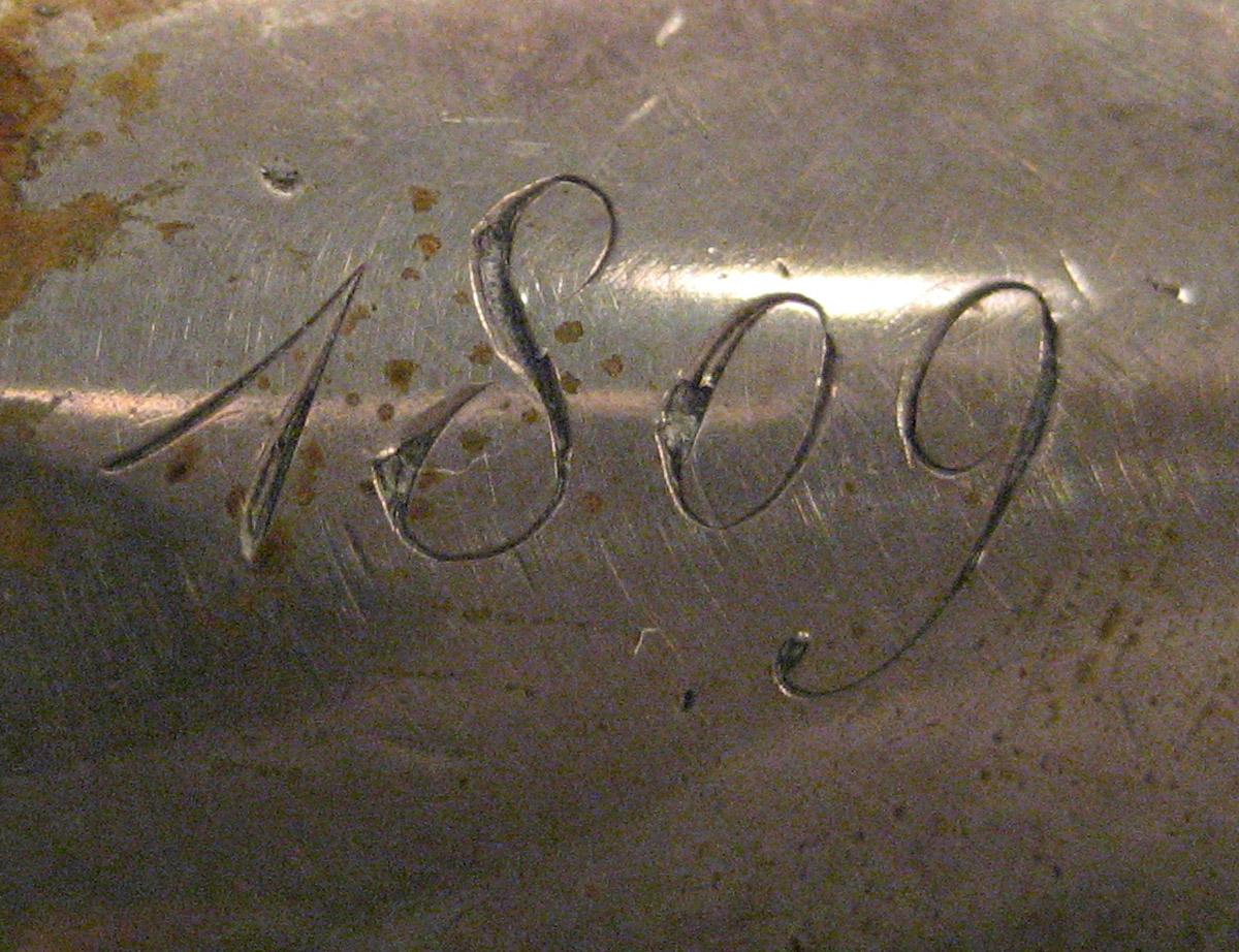 1954.0079.025 Knife (inscription)