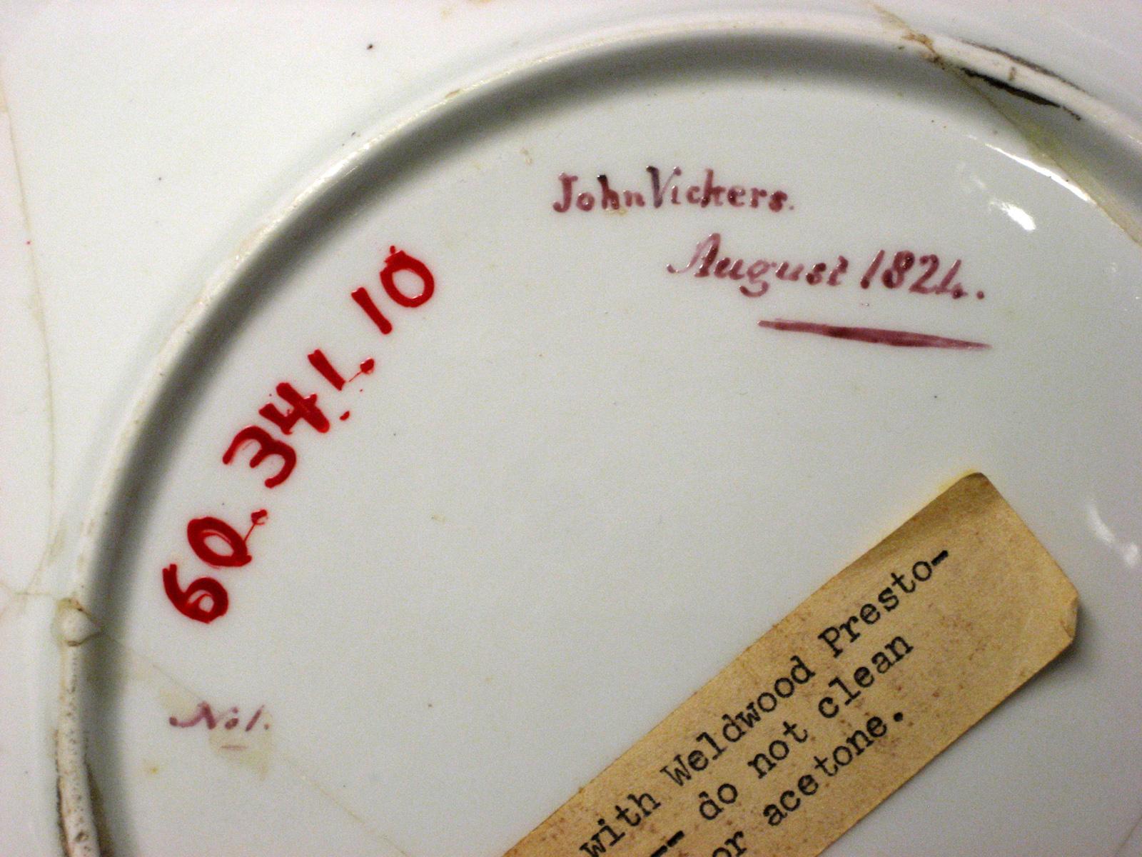 1960.0341.010 Plate (inscription)
