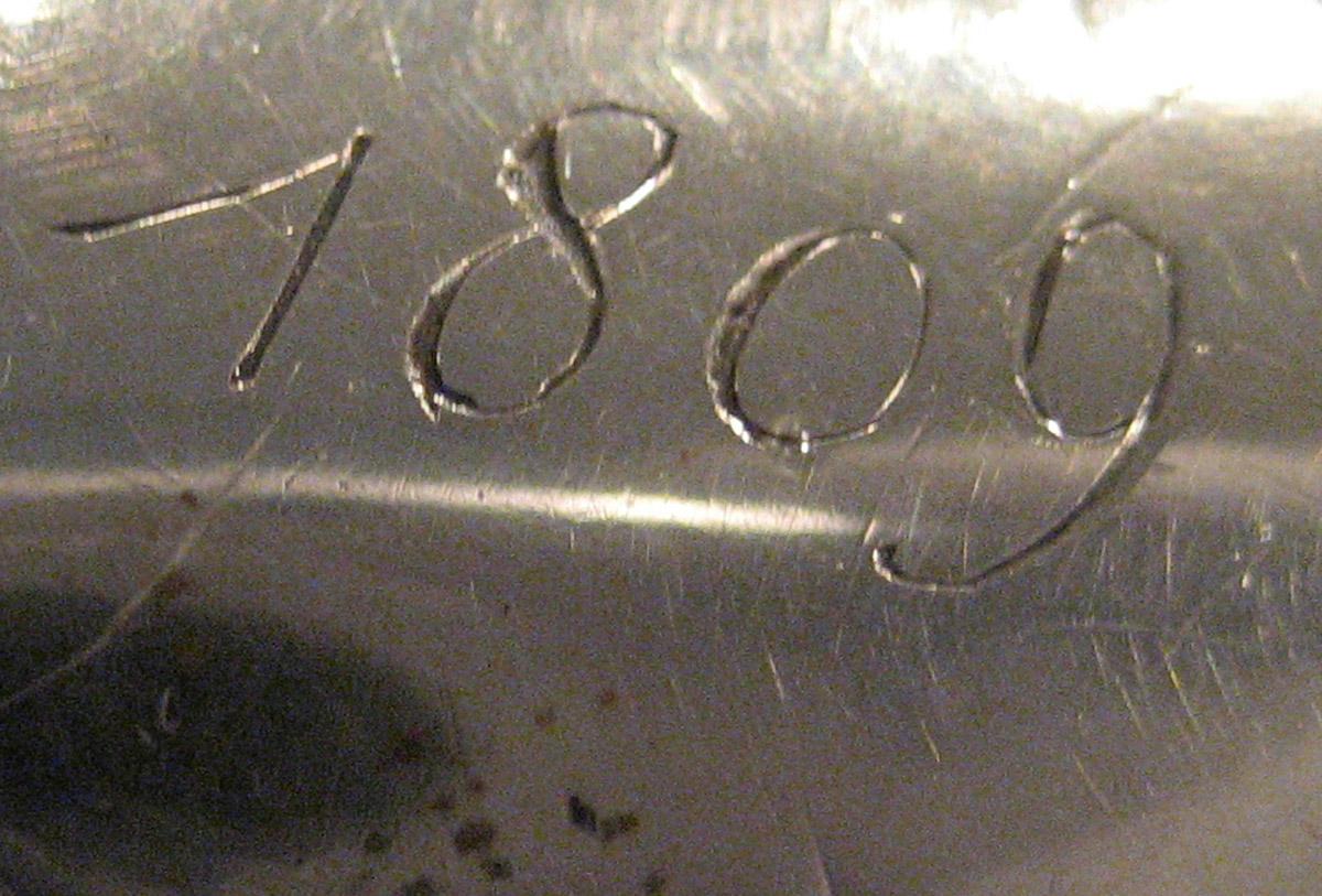 1954.0079.042 Knife (inscription)