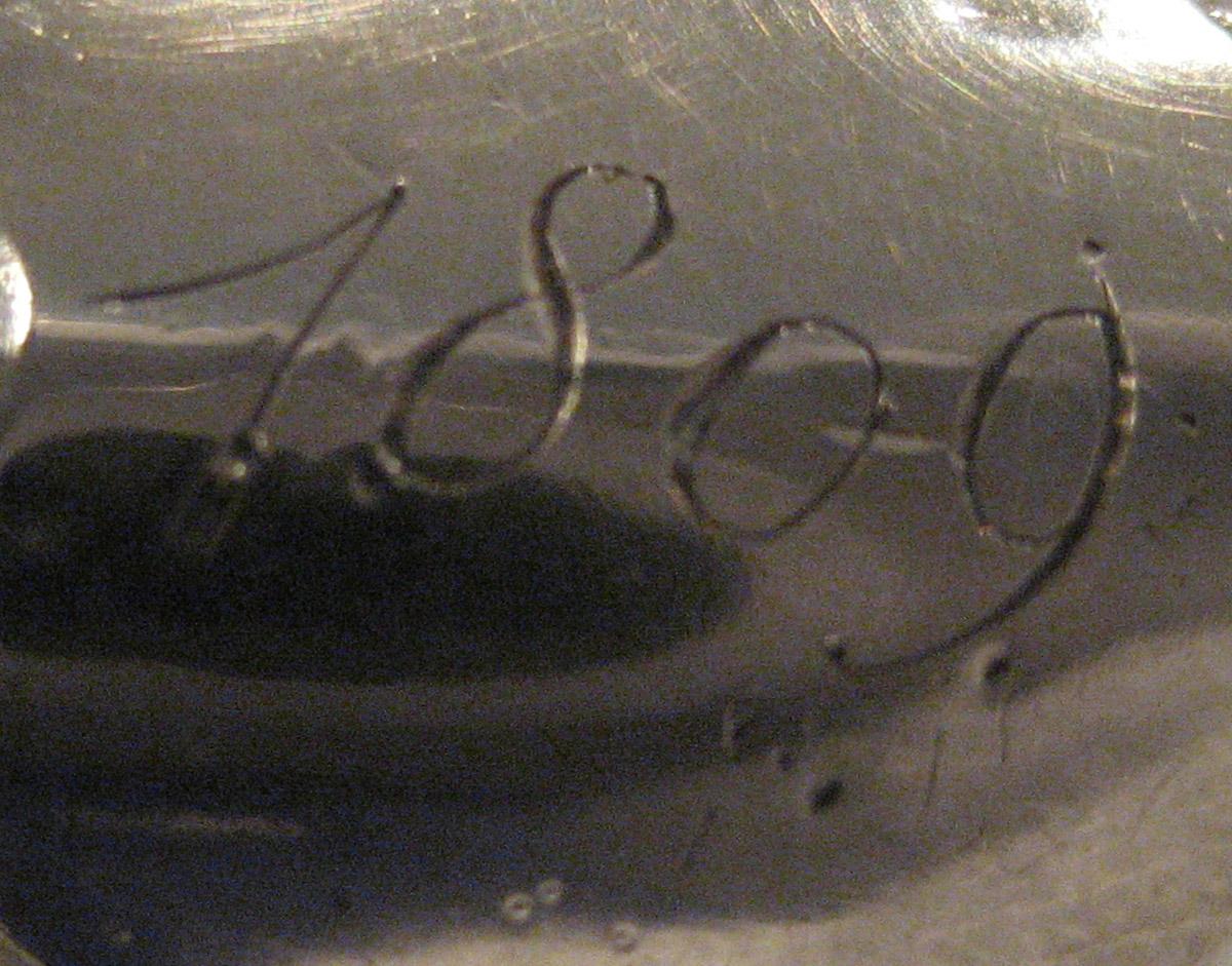 1954.0079.045 Knife (inscription)