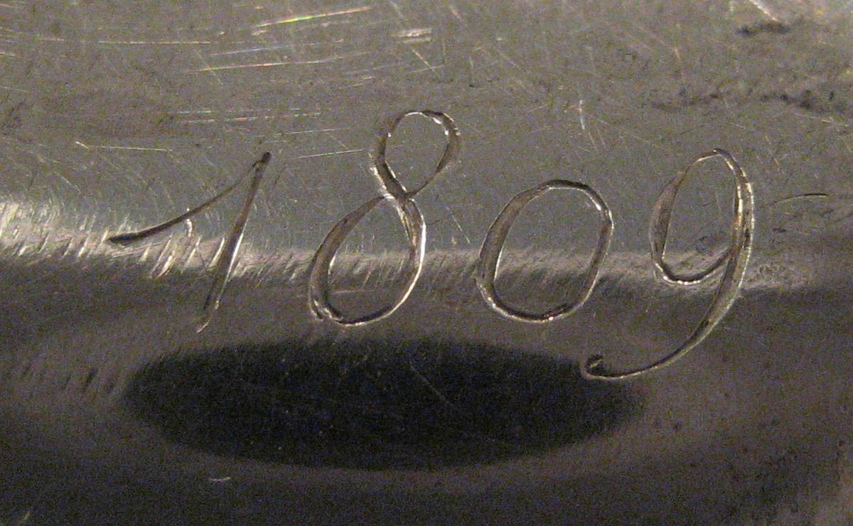 1954.0079.046 Knife (inscription)