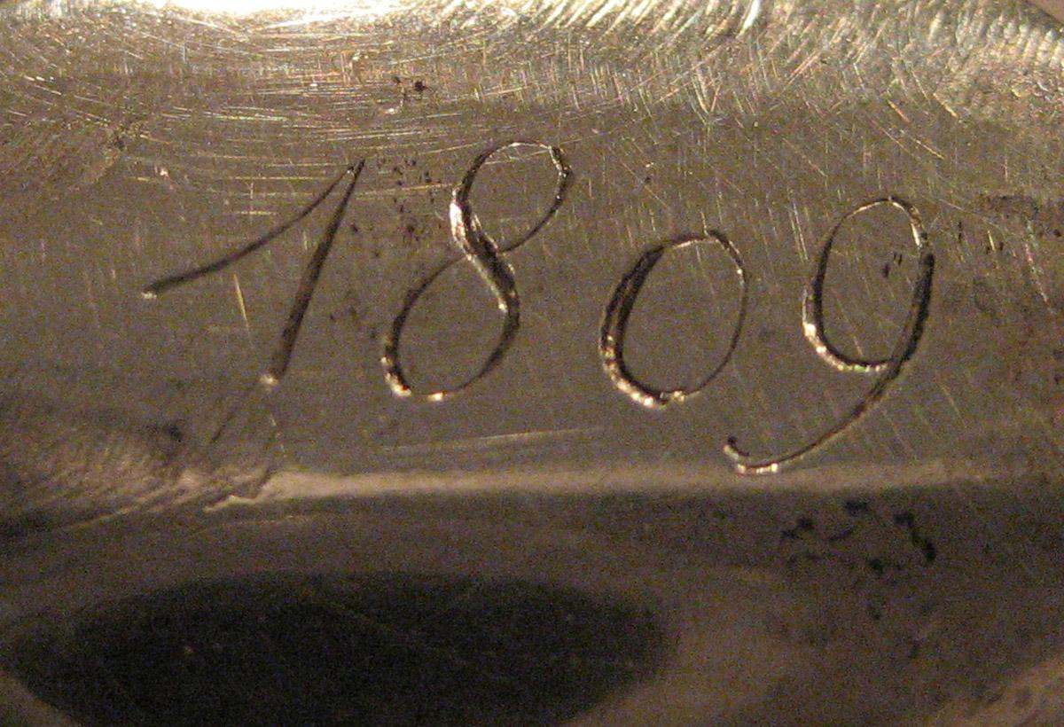 1954.0079.047 Knife (inscription)