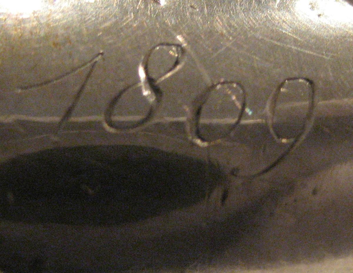 1954.0079.048 Knife (inscription)