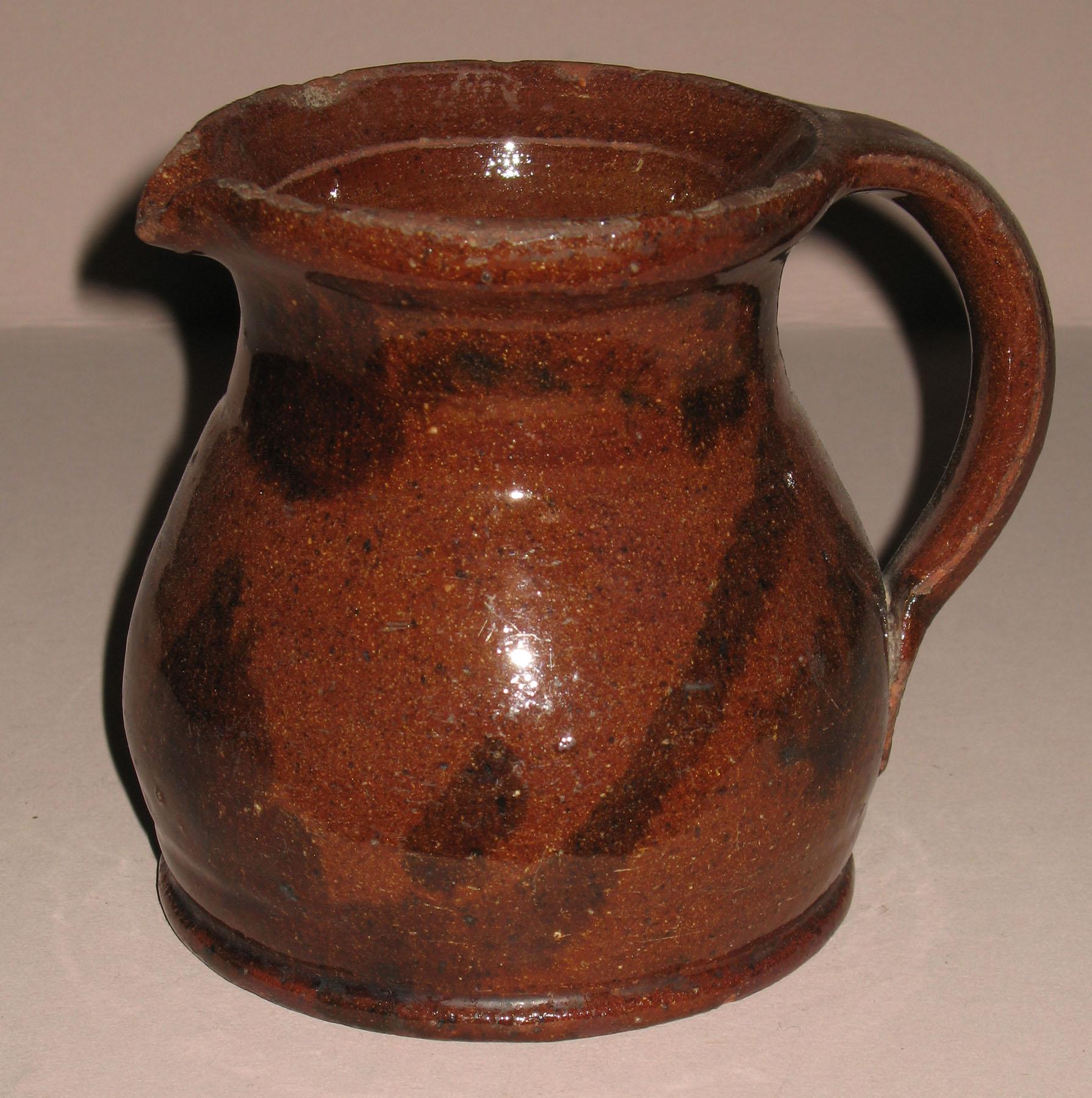 1960.0563 Redware jug or pitcher